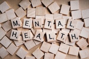 mental health spelled with scrabble board pieces